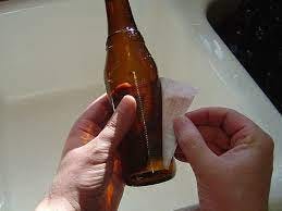 Peeling labels from beer bottles