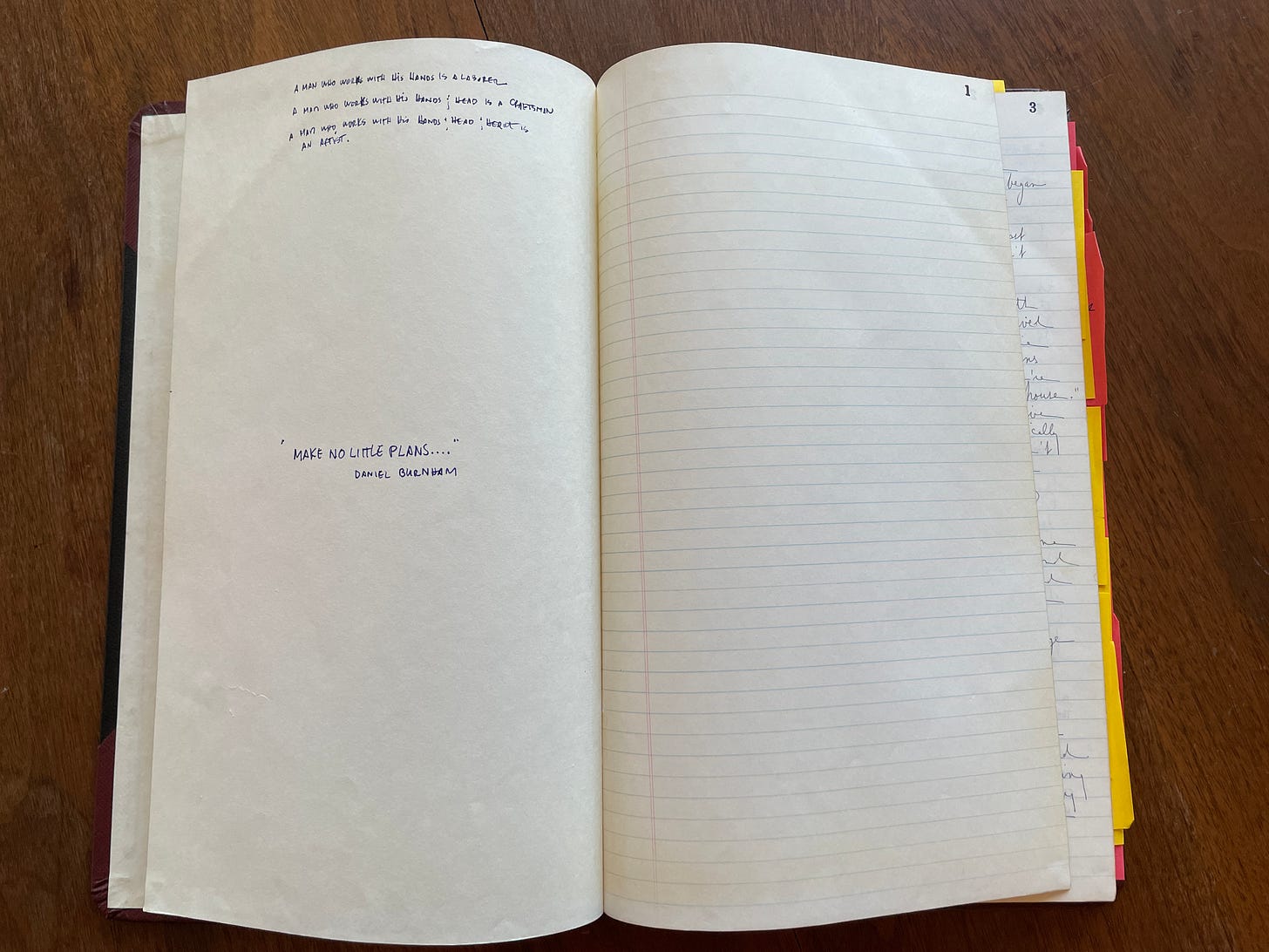 Open notebook with handwritten inscription on the left side. The right page is blank.