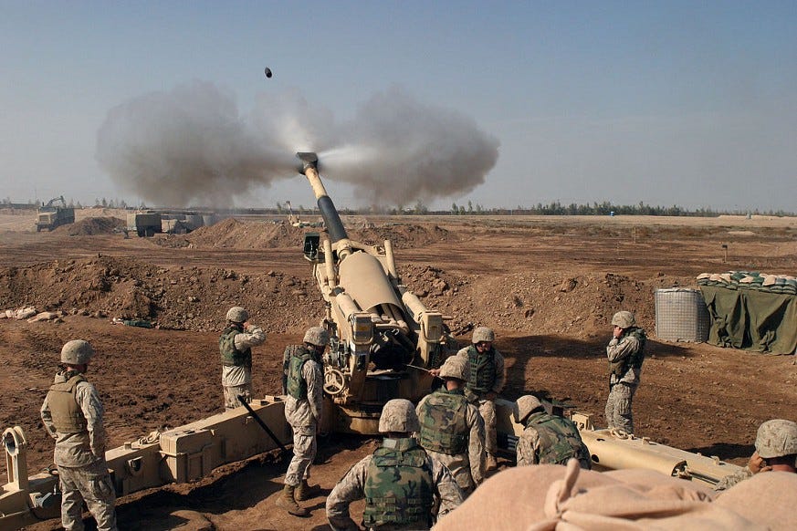 Howitzer canon and Marines in battle of Fallujah, Iraq