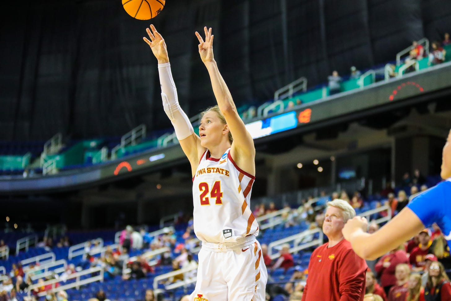 GREENSBORO, NC - MARCH 25: Ashley Joens (24) of the Iowa State Cyclones shoots a three pointer during the NCAA Division I Womens Basketball Championship Sweet Sixteen round game between the Iowa State Cyclones and the Creighton Bluejays on March 25, 2022, at Greensboro Coliseum in Greensboro, NC.