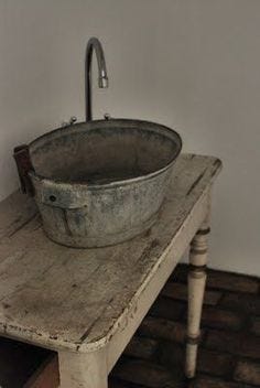 Could be fun to make bathroom in attic very basic with a galvanized bucket sink on an old table. Rustic chic decor in the most underdone way.