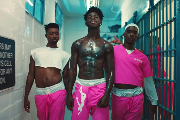 From center, Lil Nas X performs in his "Industry Baby" video.