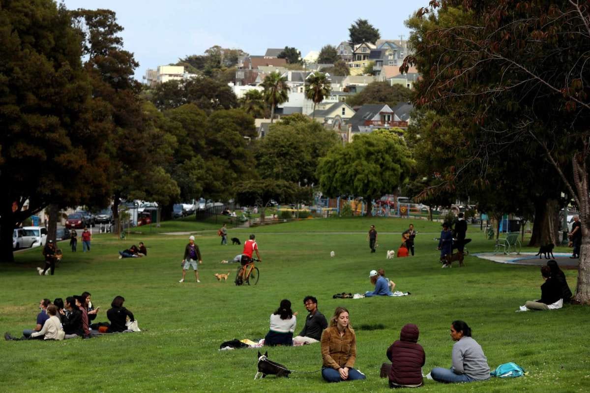 People hang out out in Precita Park in Bernal Heights. The district’s population is the same as 10 years ago.