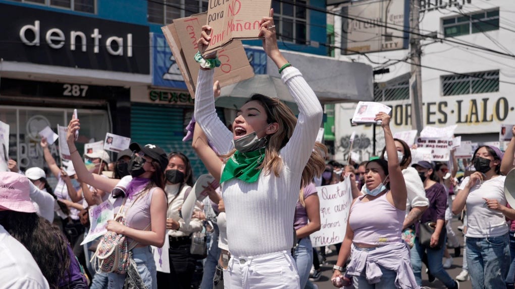 Women march against the recent murders of several women, in the Mexico City suburb of Nezahualcoyotl, where two of the women were killed last week, Sunday, April 24, 2022. (AP Photo/Fernanda Pesce)