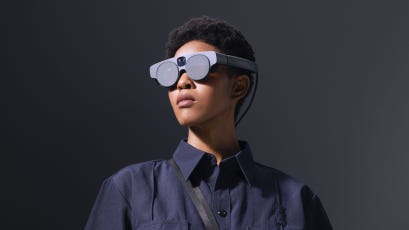 A model wears the Magic Leap 2 augmented reality headset.