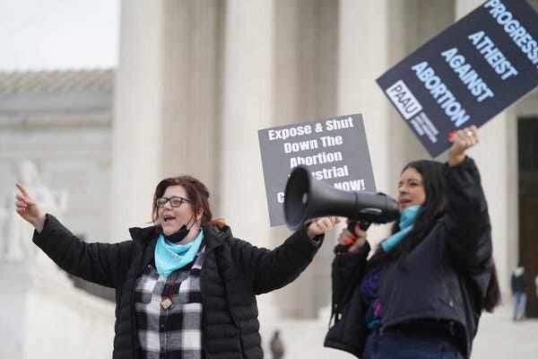 Lauren Handy, left, and Terrisa Bukovinac, both anti-abortion activists, protesting outside the Supreme Court in Washington in December.