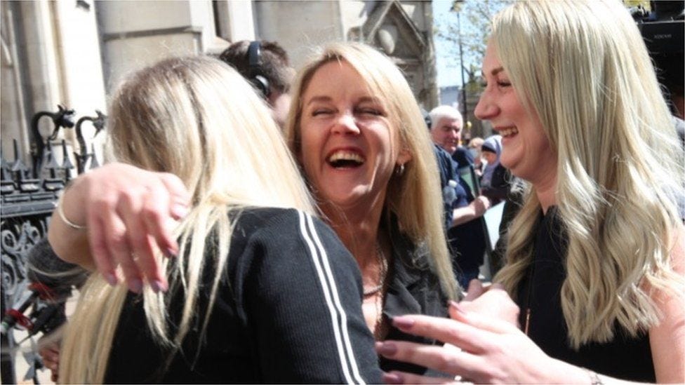 Former post office worker Janet Skinner (centre) outside the Royal Courts of Justice, London, after having her conviction overturned by the Court of Appeal