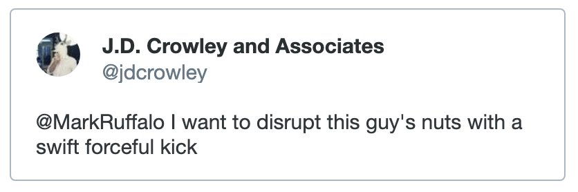 A screenshot of a tweet from @jdcrowley in response to Mark Ruffalo, saying “I want to disrupt this guy’s nuts with a swift forceful kick”