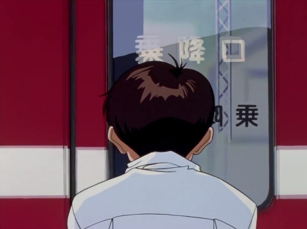 Shinji standing in front of the train doors.