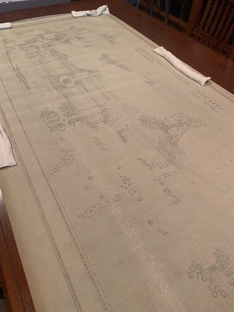 Pencil landscape plan of the administration building grounds on a long, wide sheet of draft paper