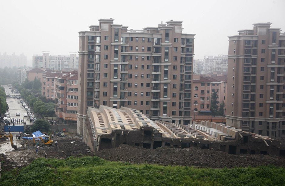 "Shanghai apartment building collapses" by Marc van der Chijs is marked with CC BY-ND 2.0.