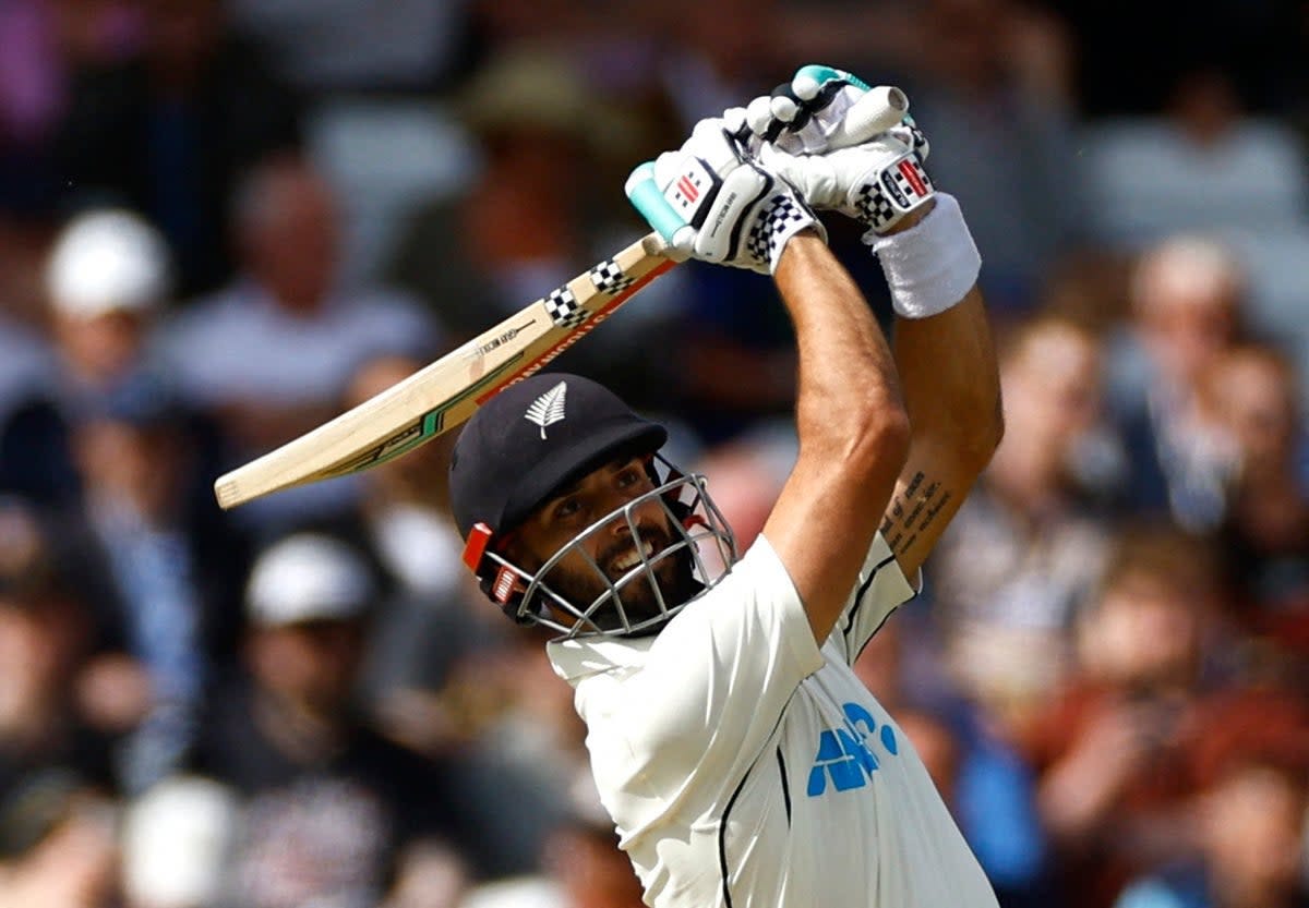 New Zealand batter Daryl Mitchell hits six directly into spectator's pint