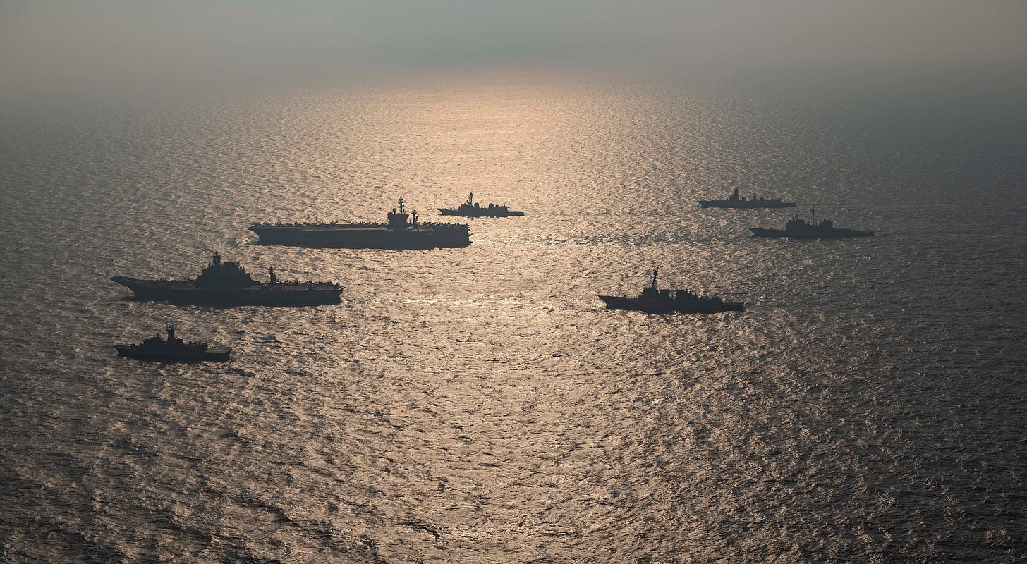 Ships from the Royal Australian Navy, Indian Navy, Japan Maritime Self-Defense Force and the United States Navy participating in the Malabar 2020 exercise. (Image: Official U.S. Navy Page, CC BY 2.0, via Wikimedia Commons)