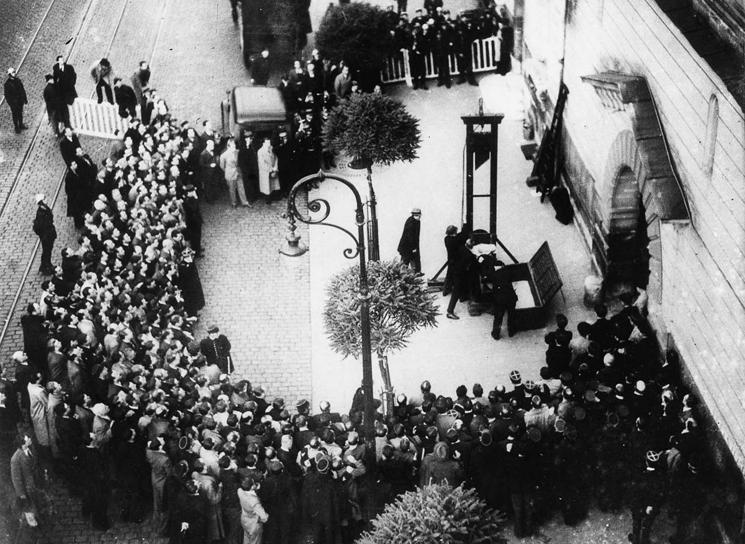 Weidmann is placed in the guillotine seconds before the blade falls.
