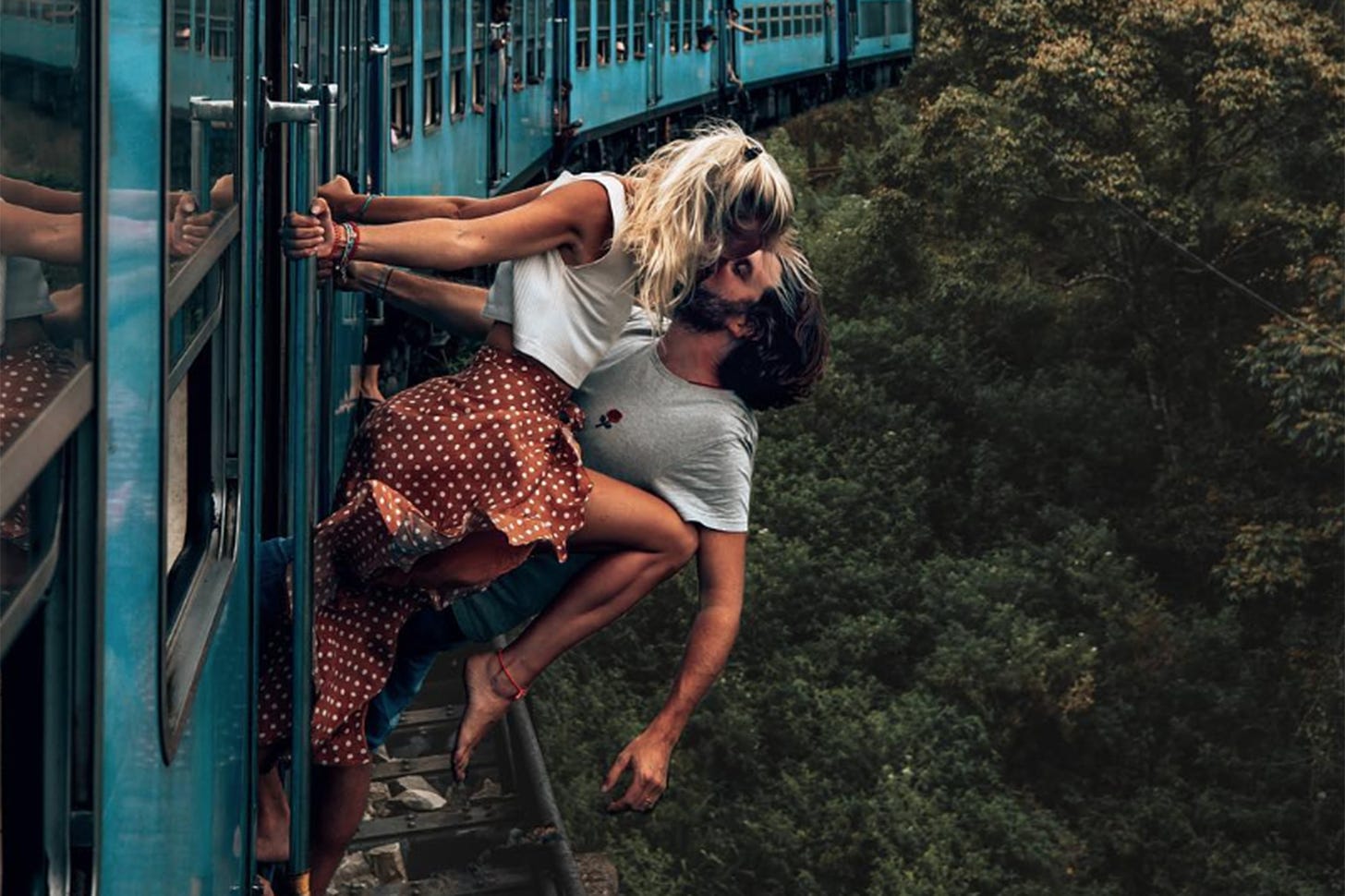 Couple defends 'dangerous' Instagram photo of sexy train stunt