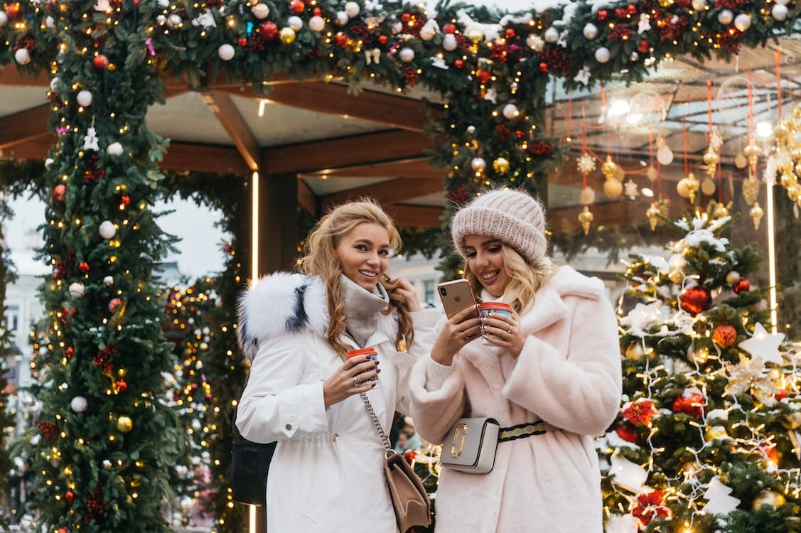 Free Two Women Near Christmas Decorations Stock Photo