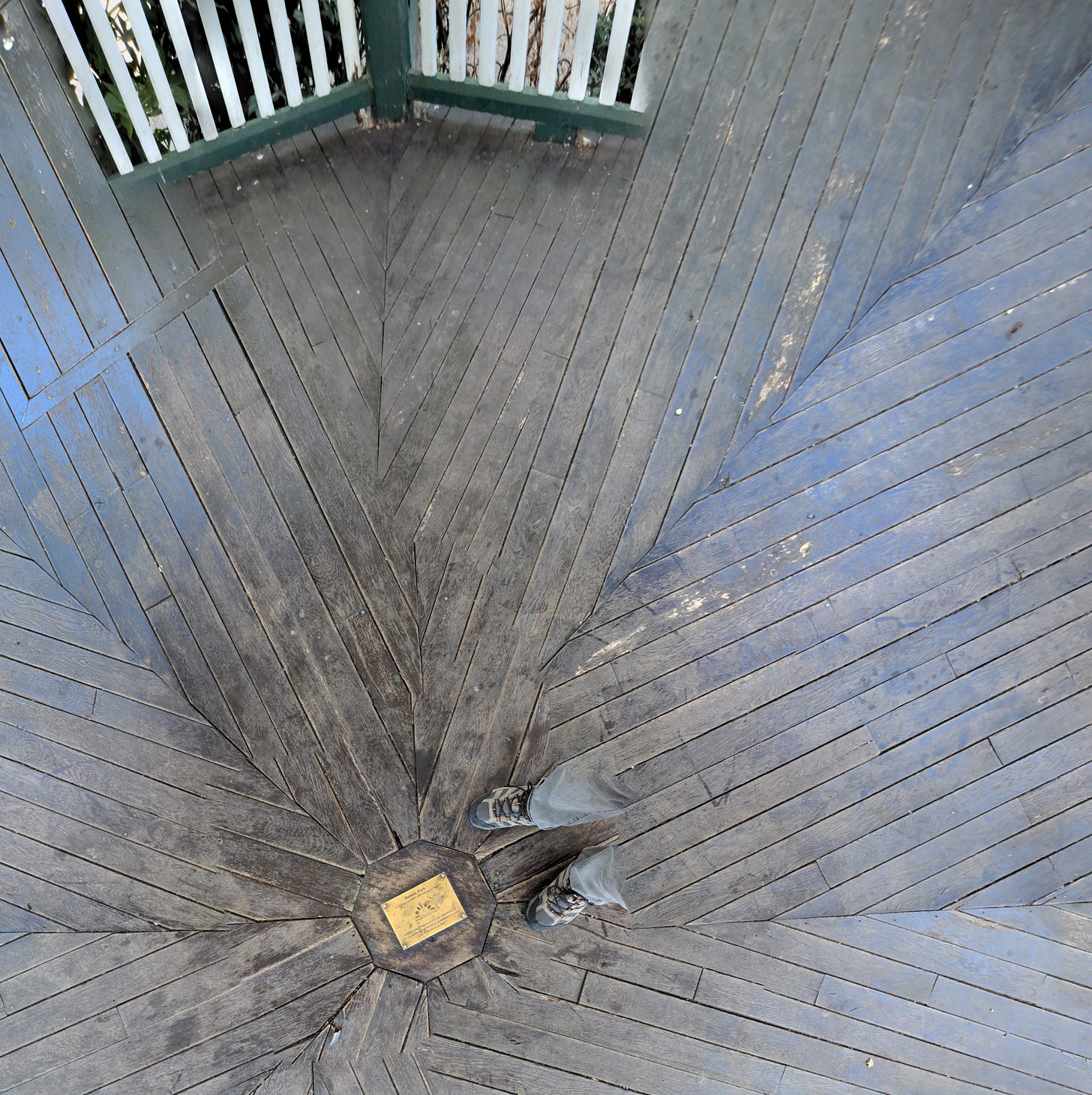 A failed photo sphere, showing the floorboards of the Ruskin Park band stand and my disembodied feet. 