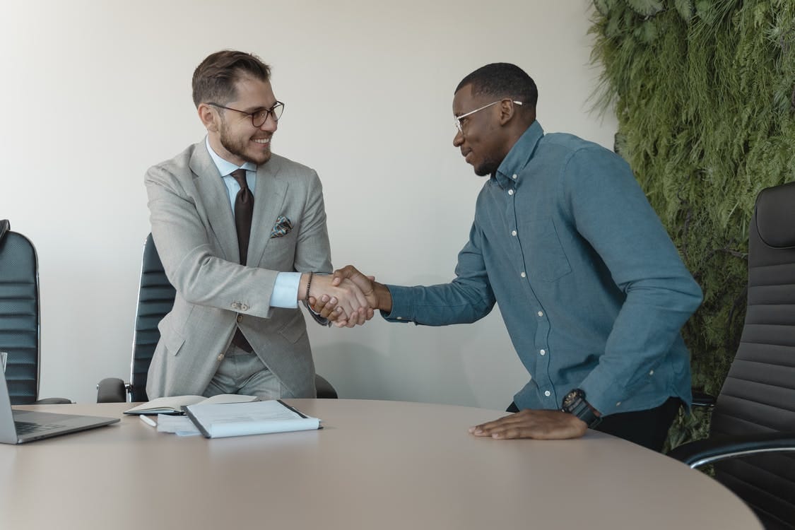 Free Man in Blue Long Sleeve Shirt Gets the Job Stock Photo