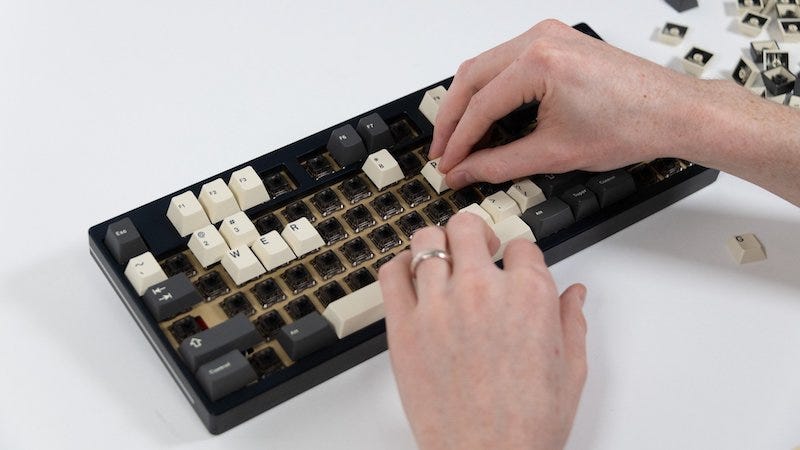 My friend's beautiful hands, assembling a high-end custom keyboard
