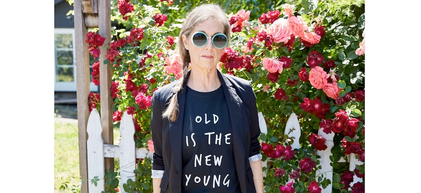 Woman wearing sunglasses and a tshirt that says "old is the new young"