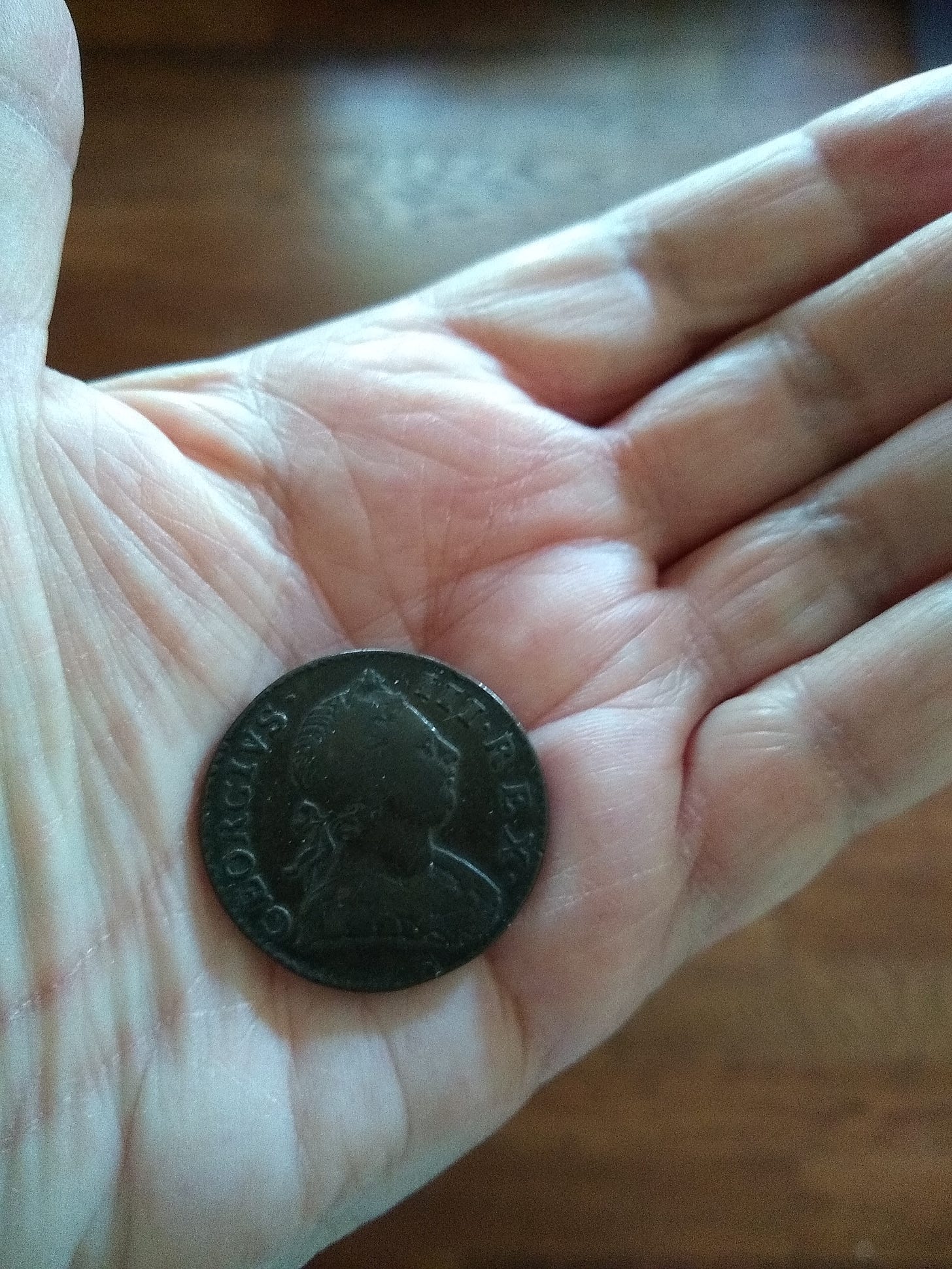 Coin lying on extended hand
