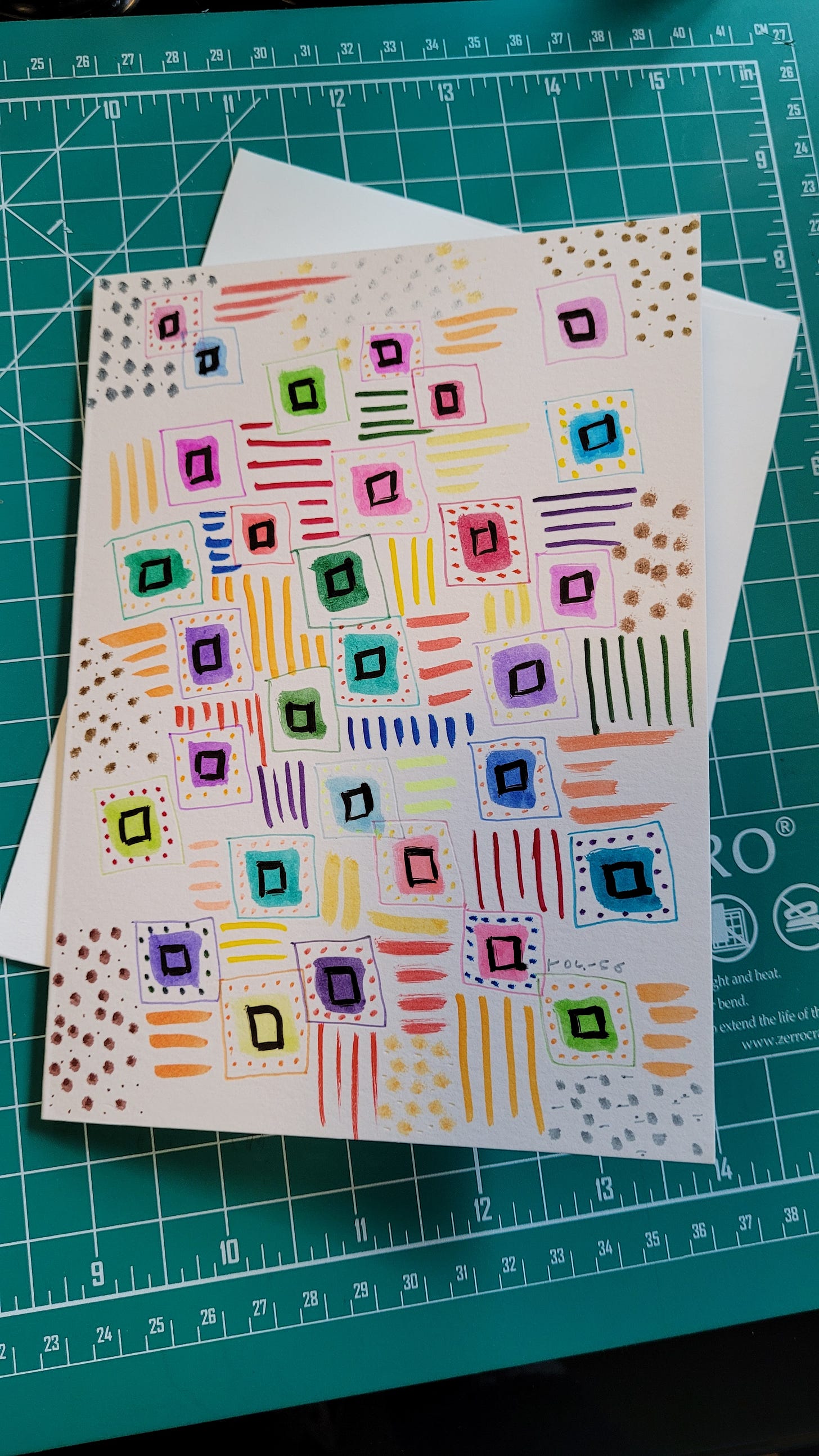 Handmade card on white cardstock with dots, lines and squares in all colors