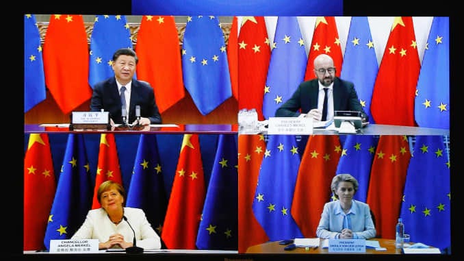 A screen shows European Commission President Ursula Von Der Leyen (Bottom R), German Chancellor, Angela Merkel (Bottom L), Chinese President, Xi Jinping (Top L) and European Council President, Charles Michel (Top R) during the European Union - China leade