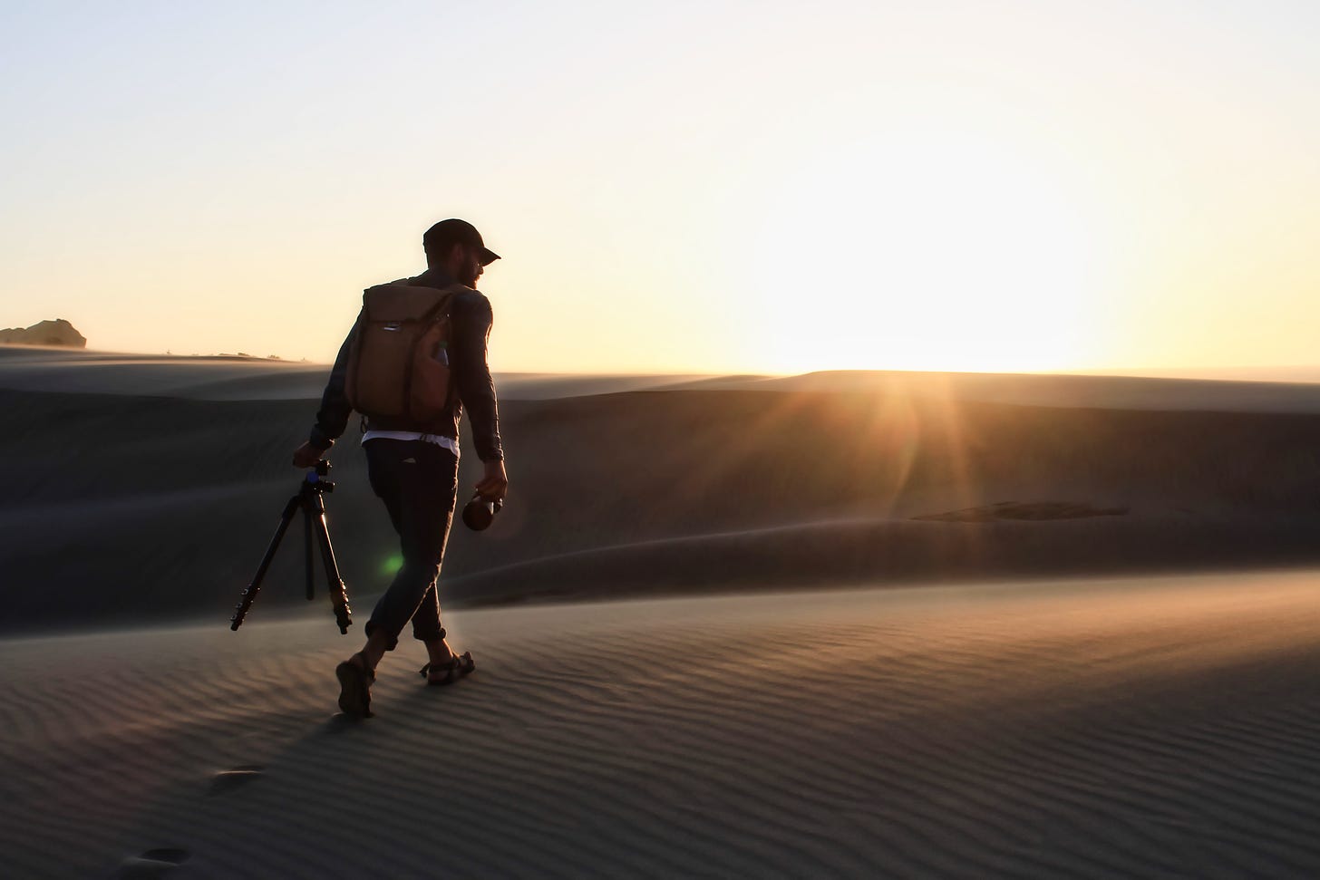 Man walking with camera gear