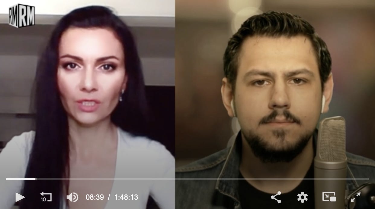 A screenshot of video, on the left is a white woman with long dark hair and dark eyes wearing a white shirt. On the right is a white man with dark hair and dark eyes and goatie beard wearing a denim jacket.