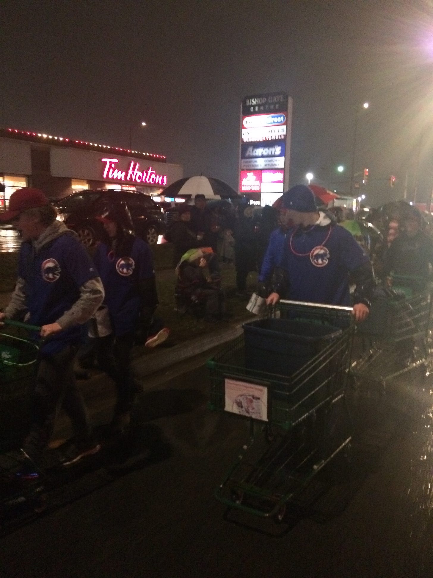 Young baseball athletes participating in Santa Claus parade collecting food items for local food bank