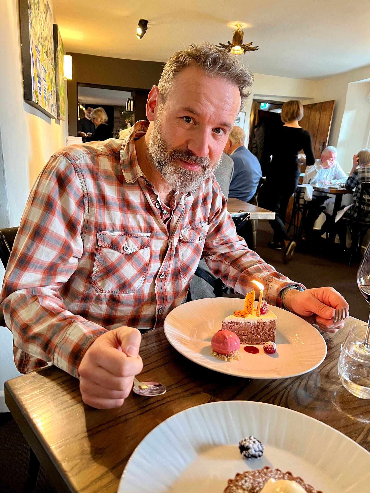 I’m sat feeling humbled at the great food experience in a casual but posh inn/restaurant. There is a small tart with a candle infront of me. It was delicious.