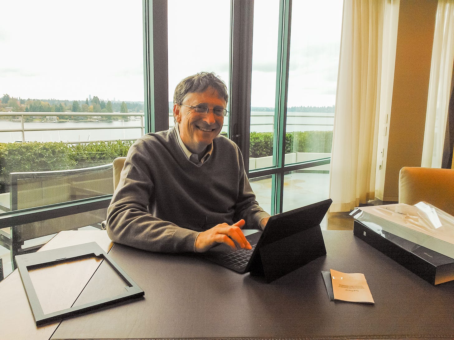 Bill Gates at desk overlooking the water view, with Surface RT use out of the box.