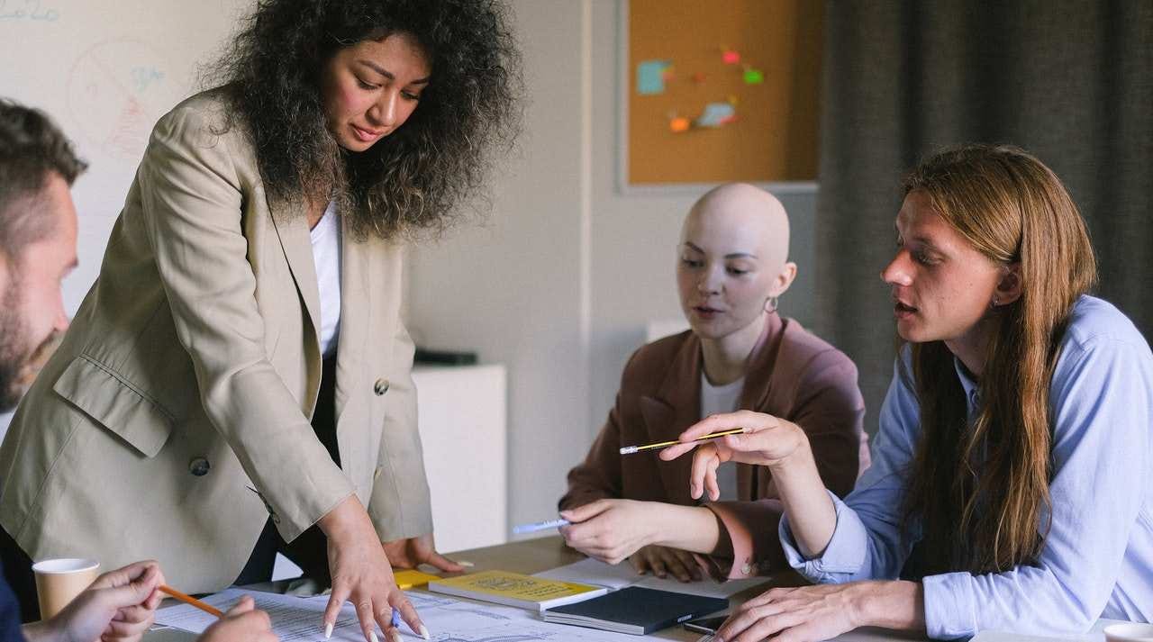 Focused colleagues brainstorming in boardroom; Photo by Anna Shvets from Pexels