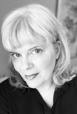 Black and white headshot of Cait Gordon