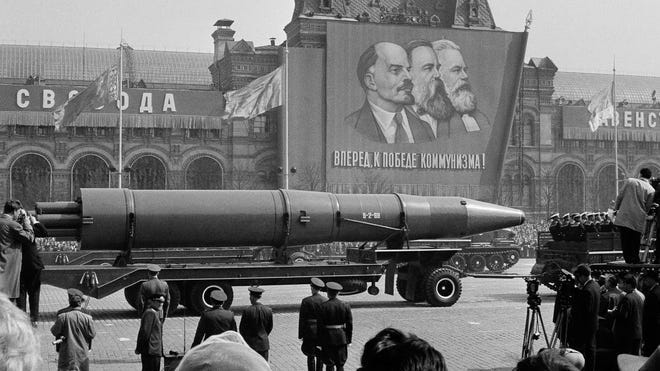 A Naval rocket is exhibited in Moscow's Red Square in front of a banner of Vladimir Lenin, Friedrich Engels and Karl Marx during the May 1, 1963, May Day parade.