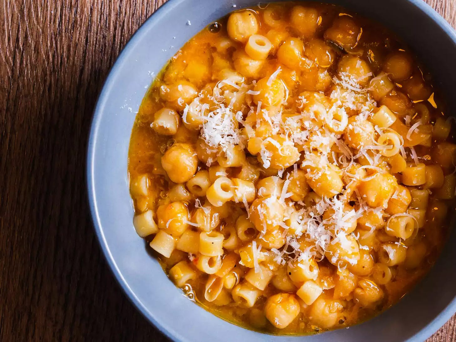 pasta e ceci in a blue bowl