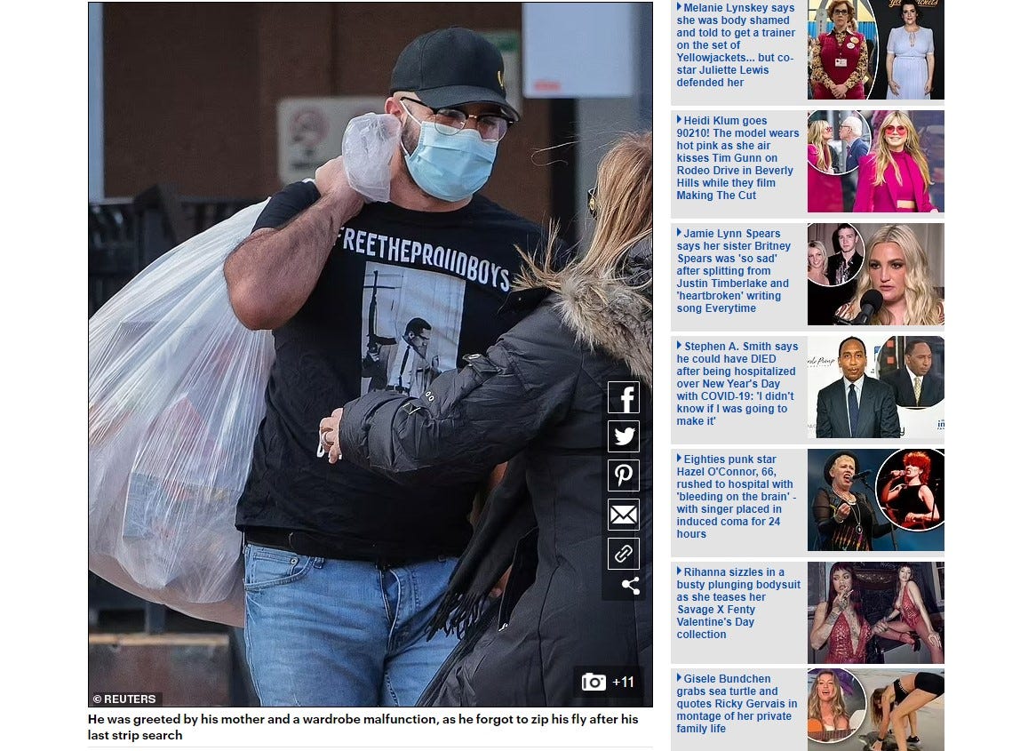 Enrique Tarrio carries a clear plastic bag over one hand. He is wearing a shirt that says Free the Proud Boys and has a man in a suit with an automatic rifle on it. He is wearing a mask and has round glasses. He is going to hug a woman with blonde hair and a coat. His fly is undone. To the right, several very trashy Daily Mail headlines