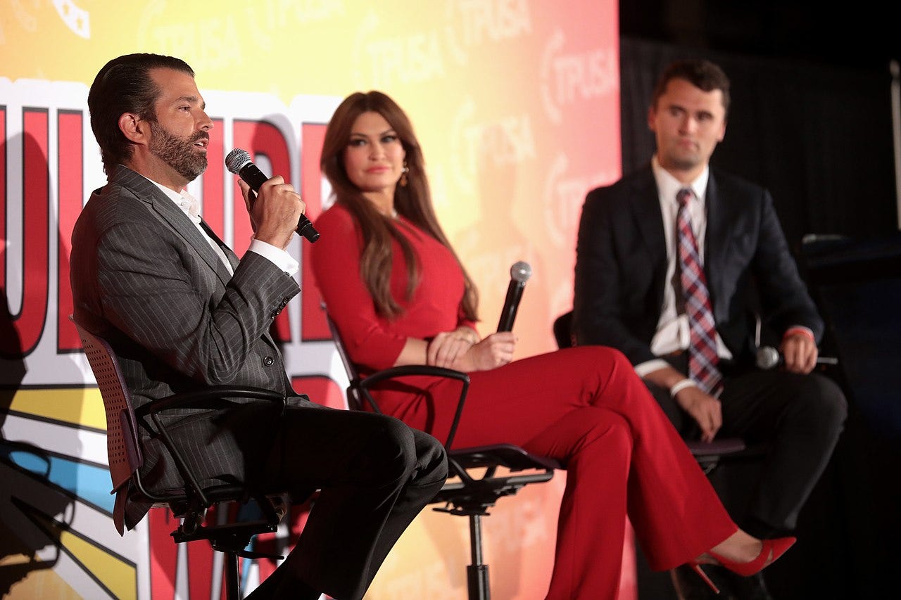 Donald Trump Jr., Kimberly Guilfoyle and Charlie Kirk speaking with attendees at the 2019 Culture War tour in Phoenix, Arizona.