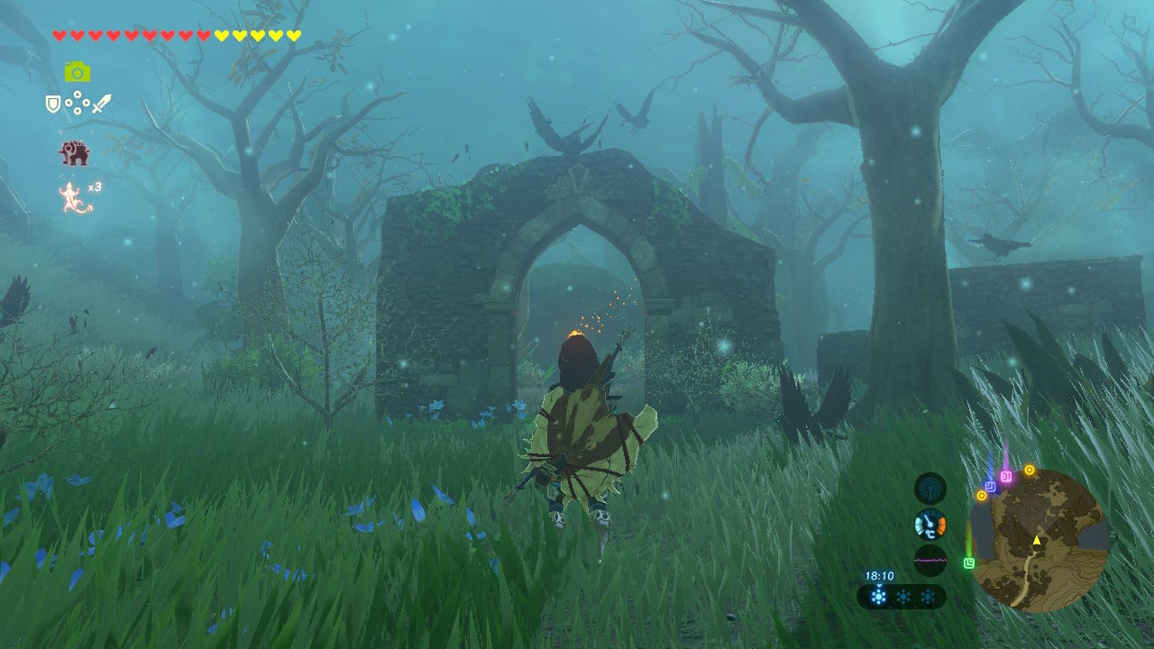 Screenshot of Breath of the Wild. Link is standing in front of a small stone arch, inside which is a torch, with sparks flying off to the right. It's misty, and the forest is full of dead trees. The torch is bright and obvious in comparison.