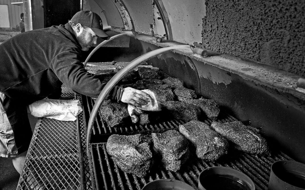 John Mueller, tending his meat on December 10, 2011.