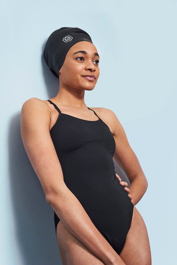 Alice Dearing, the first Black female swimmer to represent Britain at the Olympics, models the &lsquo;Soul Cap.&rsquo;