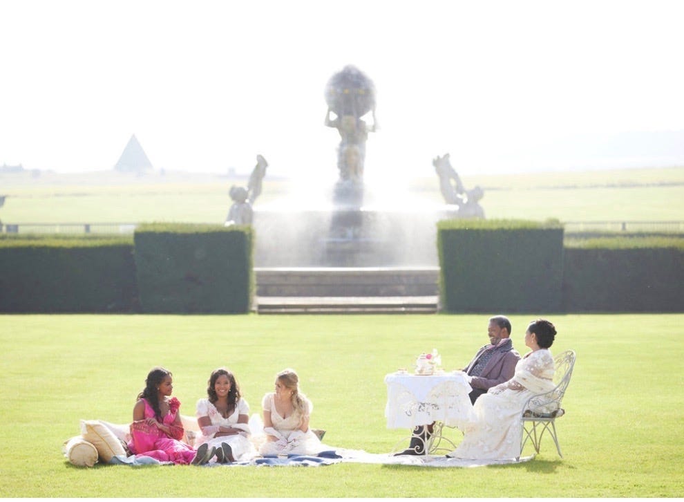 The Rémy family and friends sit on a lawn with a fountain in the background, and the caption: Nicole Rémy sits on the grounds of the UK’s Castle Howard, with sister Danie Baker, friend Tessa Cleary, father Claude Rémy and other Claire Rémy - maybe the best family ever to grace reality TV, on ‘The Courtship’. Photo: Sean Gleason/USA Nework The Rémy family and friends sit on a lawn with a fountain in the background, and the caption: Nicole Rémy sits on the grounds of the UK’s Castle Howard, with sister Danie Baker, friend Tessa Cleary, father Claude Rémy and other Claire Rémy - maybe the best family ever to grace reality TV, on ‘The Courtship’. Photo: Sean Gleason/USA Nework