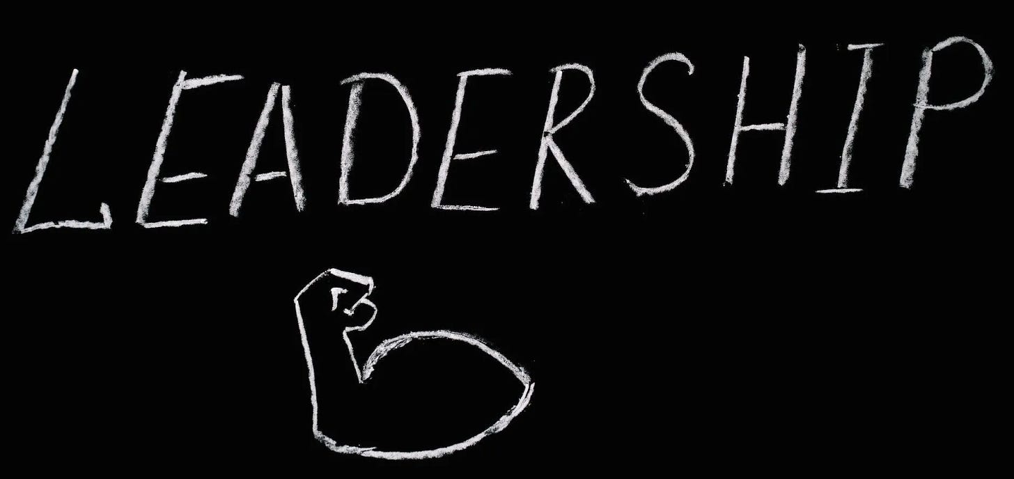 leadership lettering text on black background with a flexed bicep