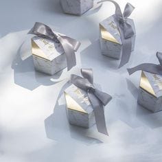 These adorable marbled style boxes come complete with ribbon. Perfect for engagements, weddings, birthdays and many other special events. Perfect for weddings, baptisms, engagement parties, wedding showers, baby showers, communions and so much more! Available in lots of 20 pieces, 50 pieces or 100 pieces. We have a variety of different beautiful ribbon colors to choose from. Each order comes with complimentary insured traceable shipping. OUR GUARANTEE: We truly believe we offer some of the most 