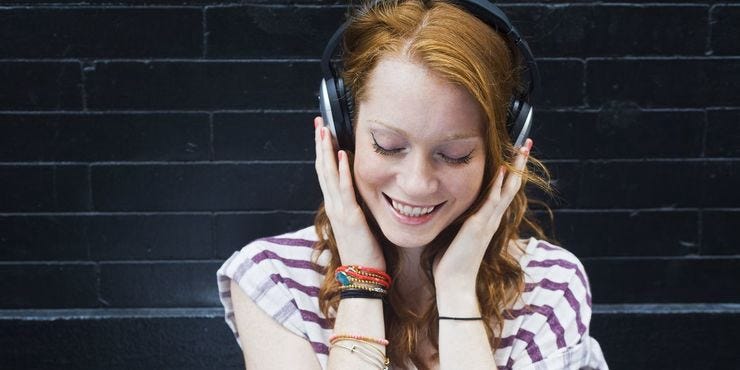Portrait of young woman wearing headphones royalty free image 507850123 1554910270