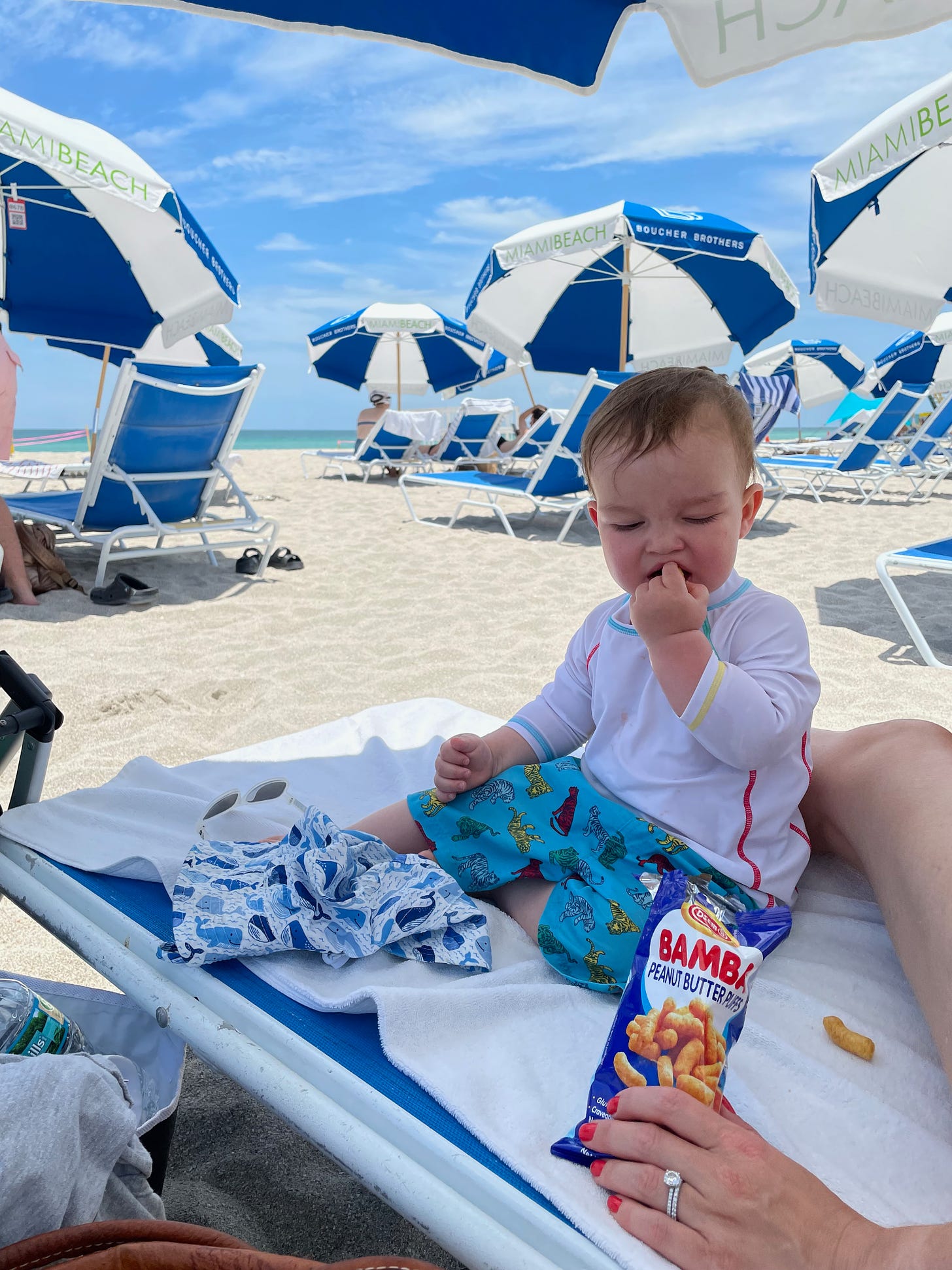baby eating bambas on Miami Beach