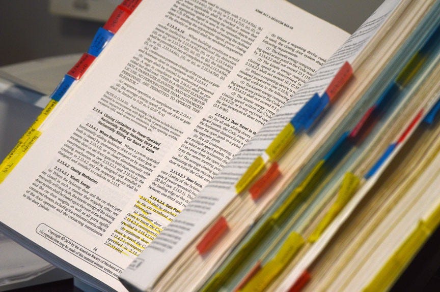 a book with highlights and sticky notes highlighting it