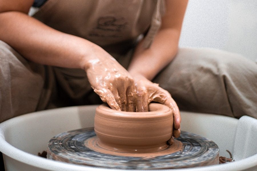 Artist working on a potter's wheel