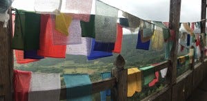 Prayer flags are blown by the wind spreading the good will and compassion.
