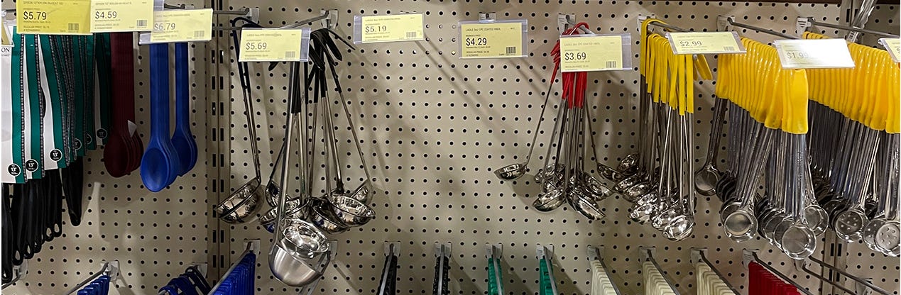 rows of ladles for sale in a store